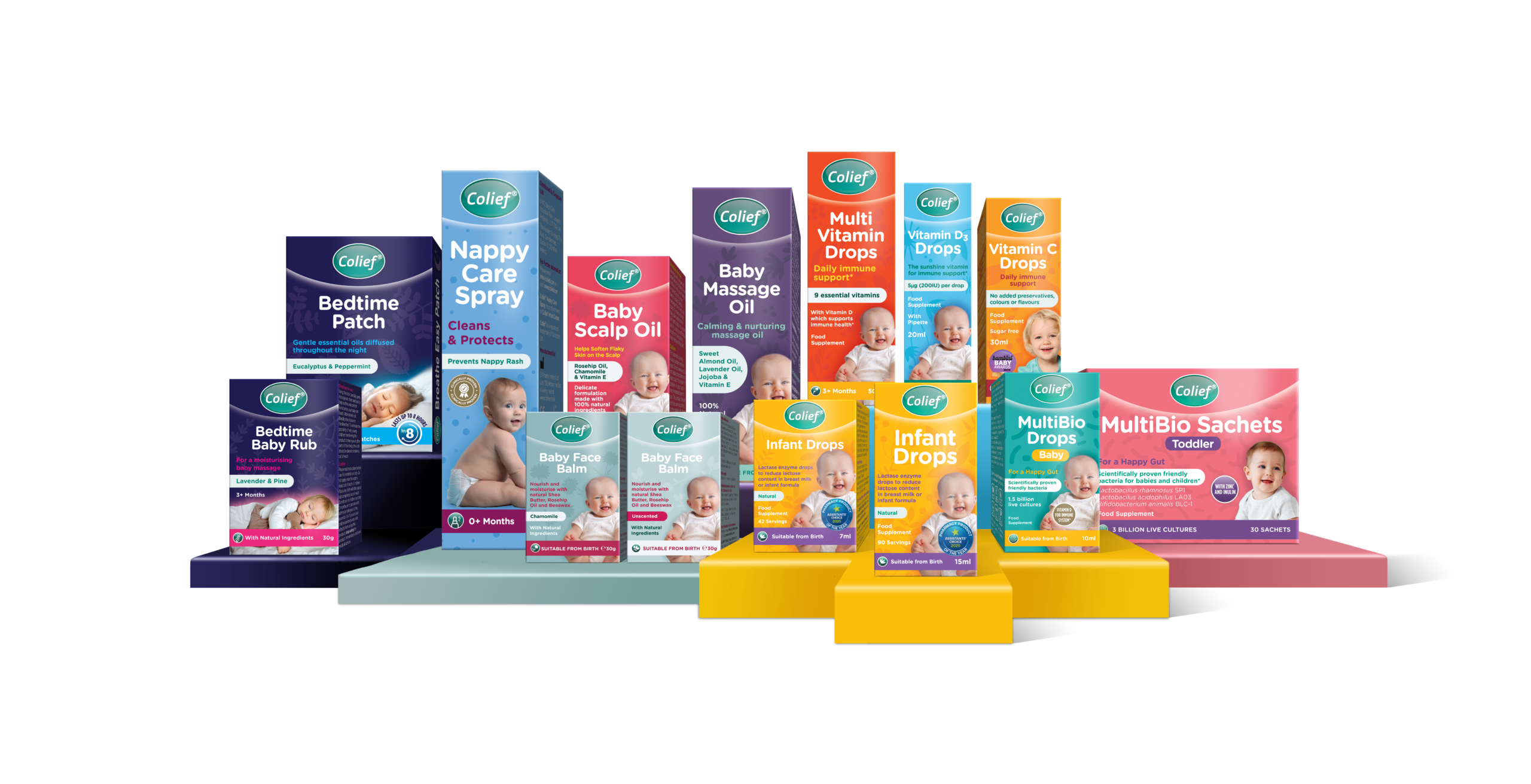 Colief Range UK - 3D 2026-V5 A promotional product lineup of Colief baby care and infant wellness products displayed on colorful podiums against a black background. The range includes Bedtime Baby Rub, Bedtime Patch, Nappy Care Spray, Baby Scalp Oil, Baby Massage Oil, Baby Face Balm (Chamomile and Unscented), Multi Vitamin Drops, Vitamin D3 Drops, Vitamin C Drops, Infant Drops, MultiBio Drops, and MultiBio Sachets. The packaging is brightly colored and features photos of babies, highlighting products for baby skincare, digestive health, vitamins, probiotics, and sleep support.